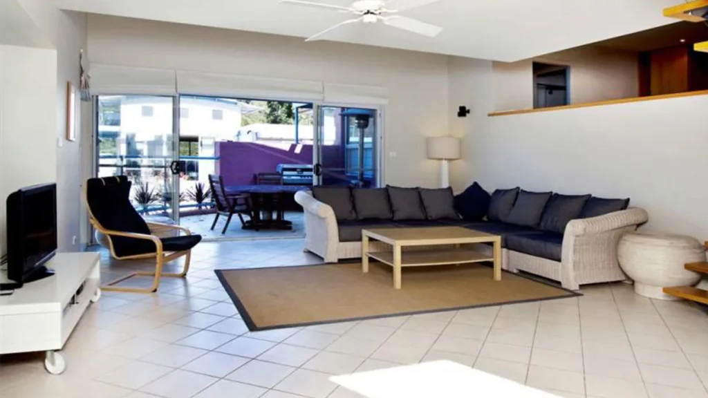 Spacious lounge with outdoor access at Beachdaze at Hyams Beach