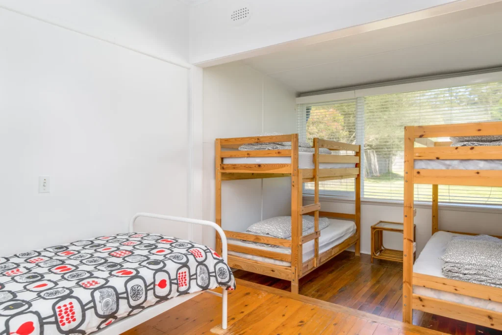 Bunk room at Bimbadgen at Hyams Beach with wooden beds