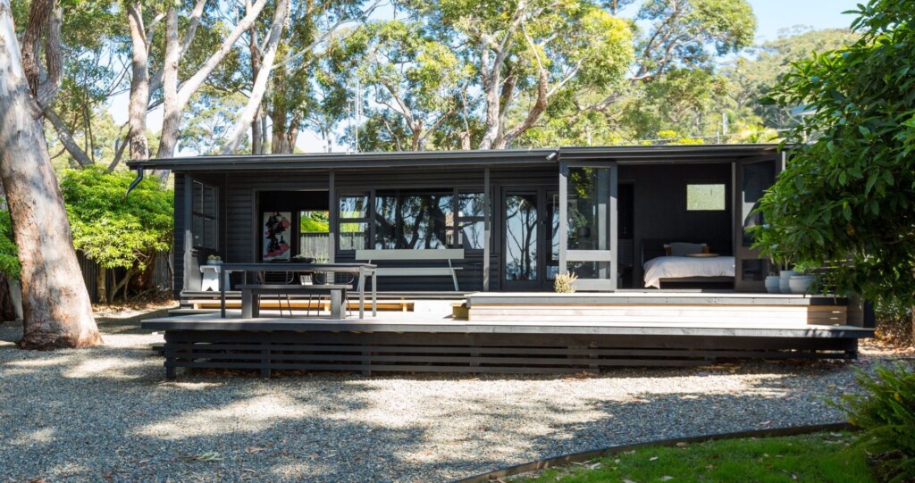 Modern dark exterior and deck of Black Shack on Hyams Beach