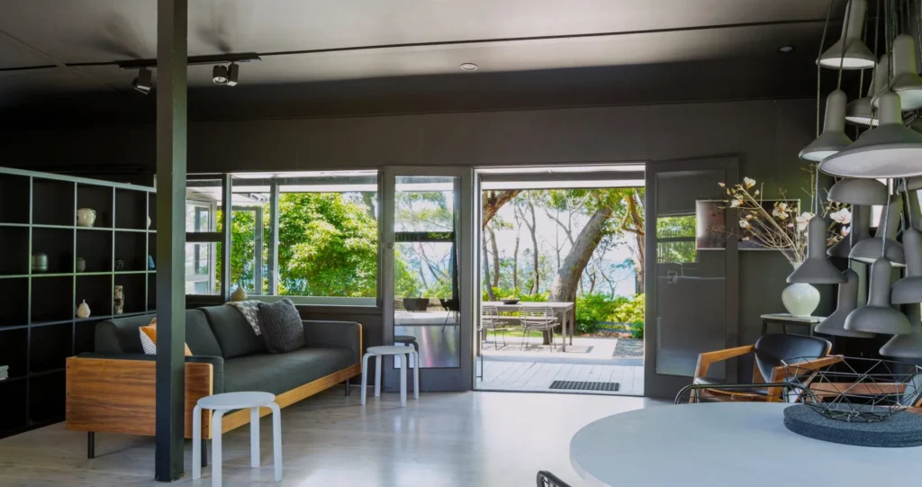 Minimalist living room at Black Shack on Hyams Beach with open views
