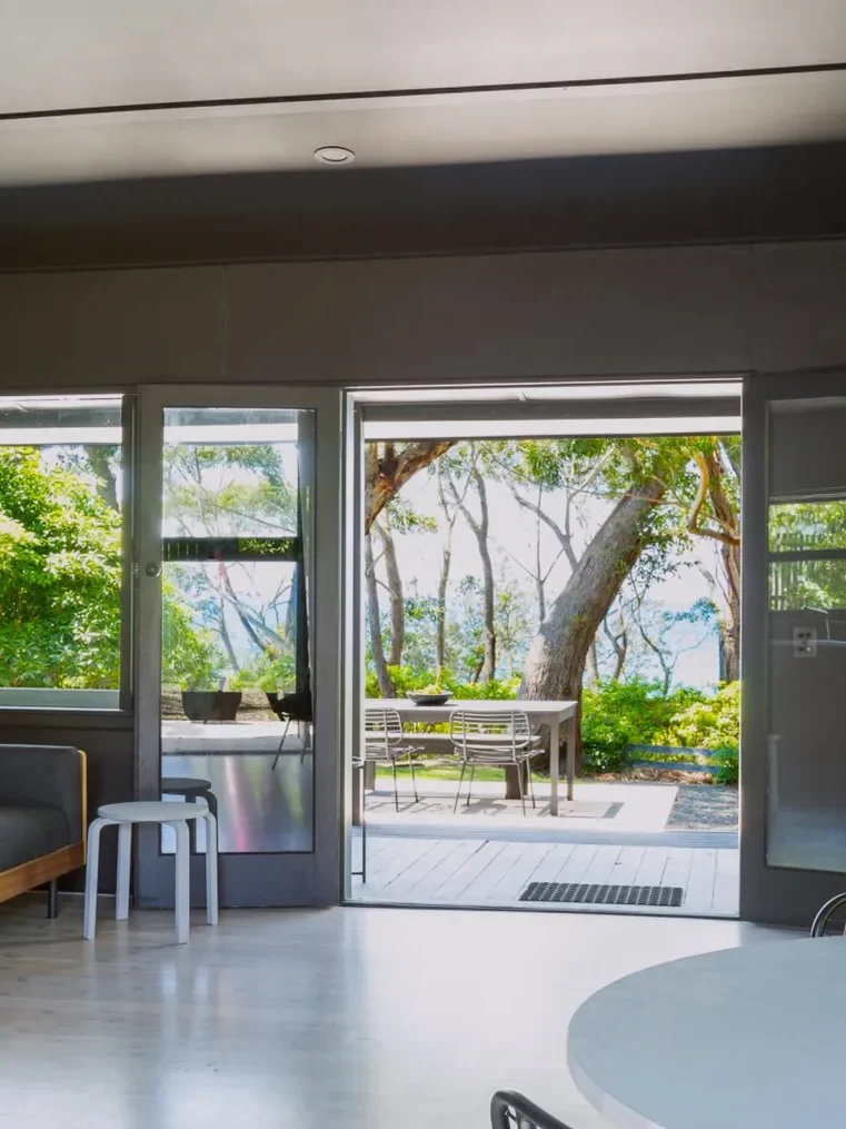 Minimalist living room at Black Shack on Hyams Beach with open views