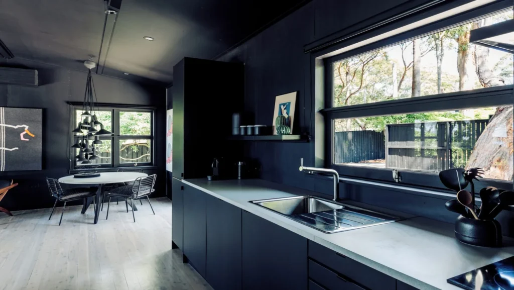 Dark minimalist kitchen area at Black Shack on Hyams Beach