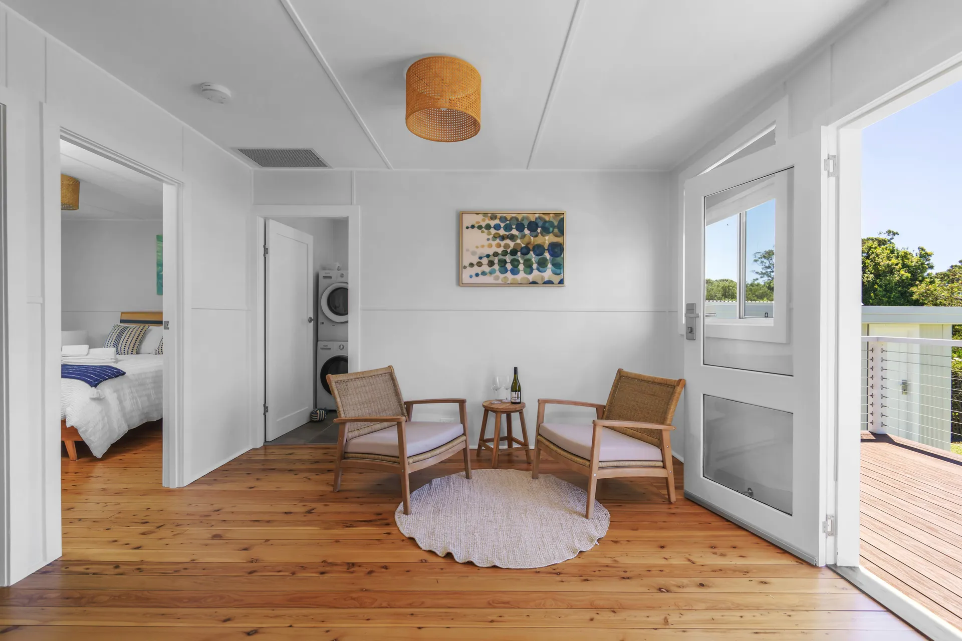 Minimalist sitting area and deck access at Charm, Hyams Beach
