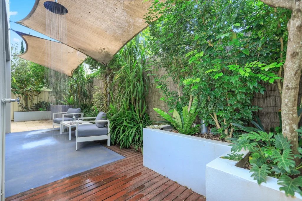 Lush outdoor shower area at Coastal Cove, Huskisson