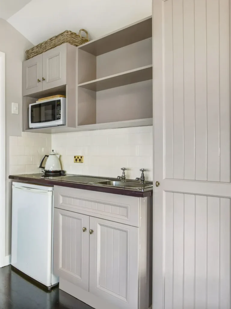 Neat kitchenette area at Cottage 1 at Hyams Beach