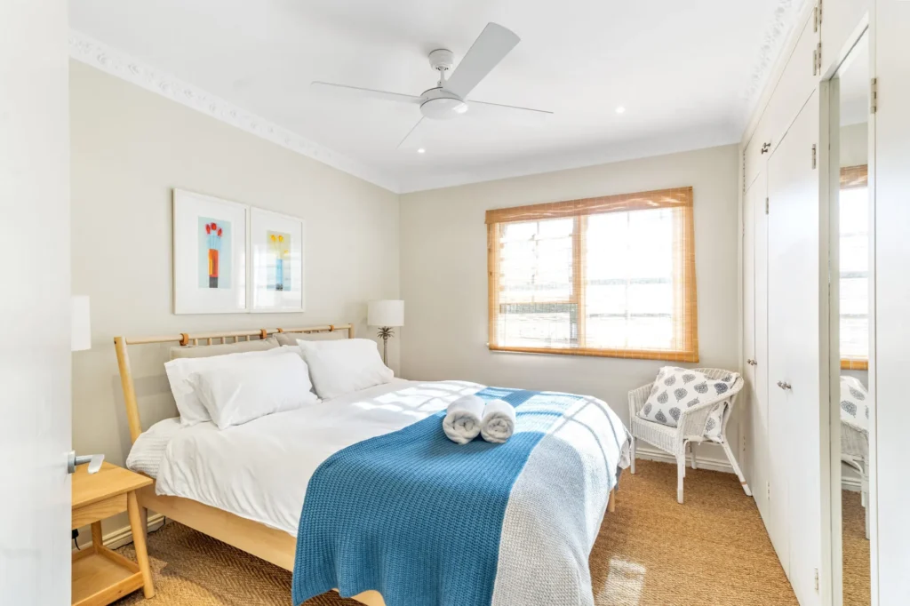 Bright bedroom at Elandra, Hyams Beach with coastal decor and natural textures
