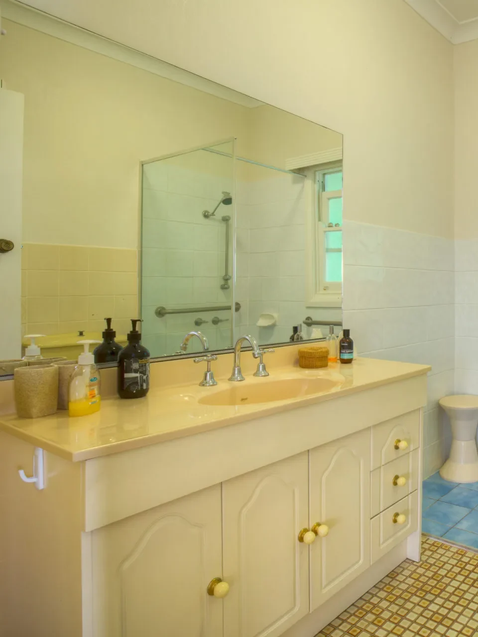 Classic bathroom with blue tile floor at Fibro Majestic at Hyams Beach