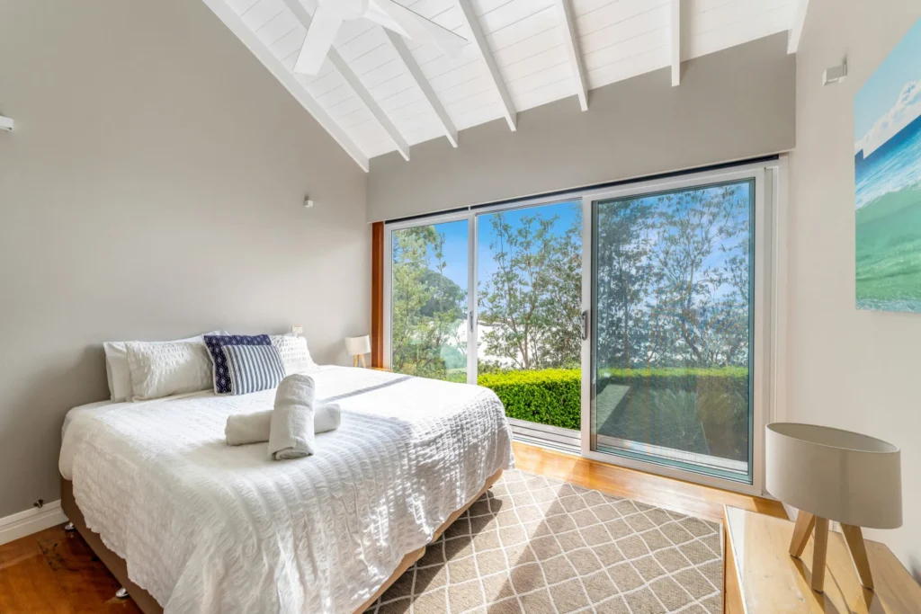 Light-filled bedroom with high ceilings at Horizons at Hyams Beach