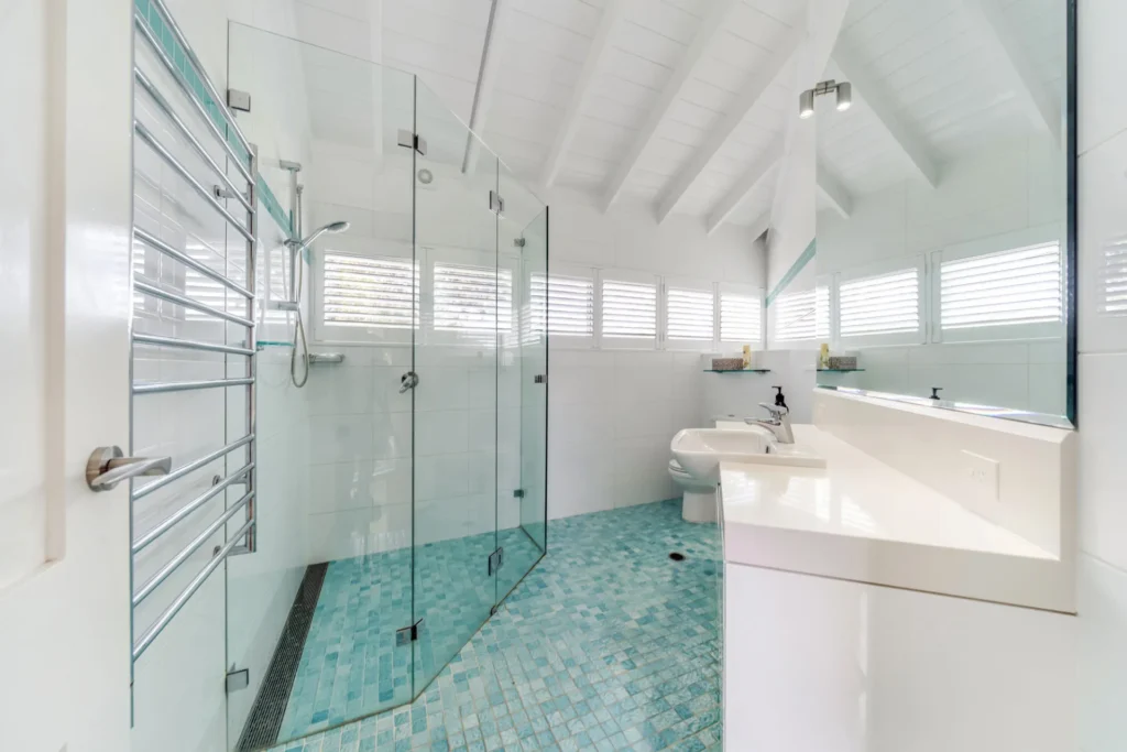 Spacious bathroom with turquoise tiles at Horizons at Hyams Beach.