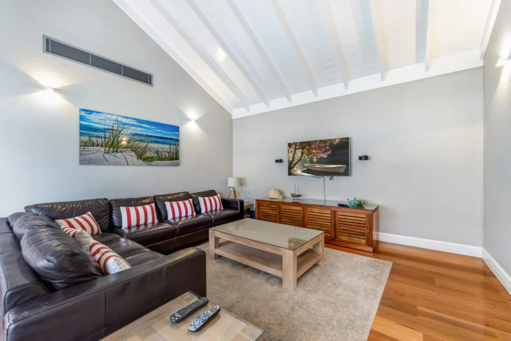 Leather sofa and vaulted ceilings at Horizons at Hyams Beach