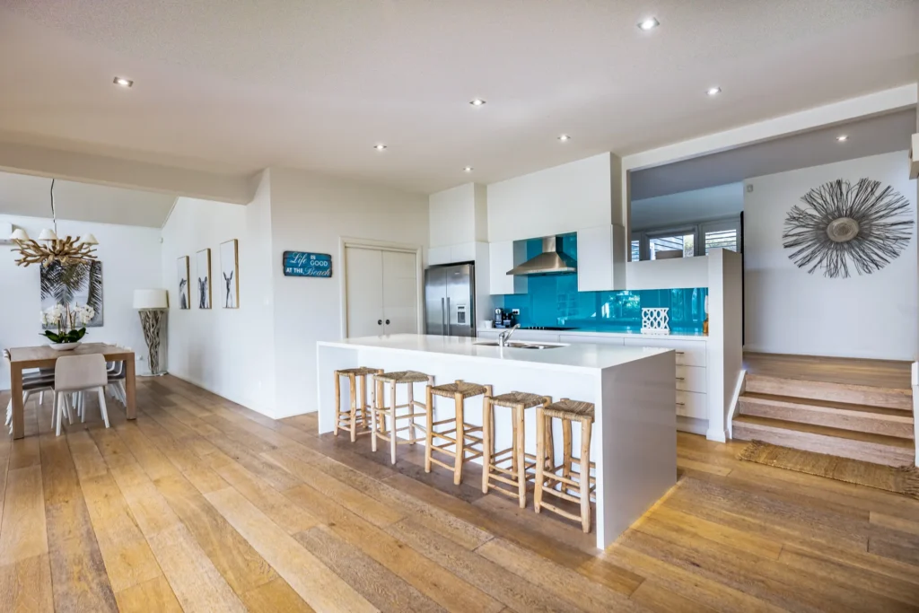 Modern kitchen with turquoise splashback at Hyamptons Beach House