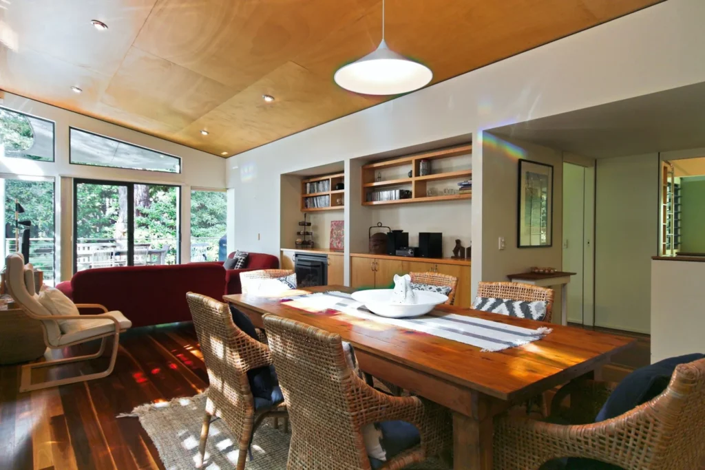 Open living and dining area with timber ceilings at Hyams Retreat