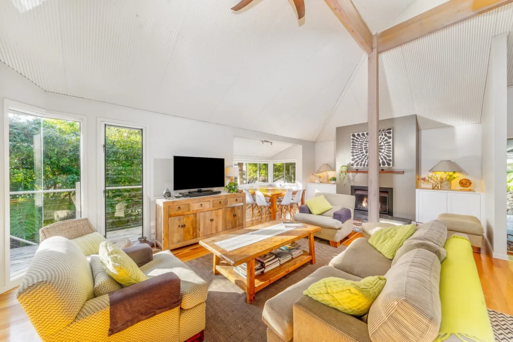 Vaulted living room with timber accents at Iluka