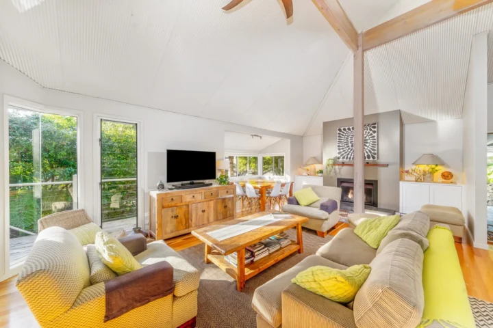 Vaulted living room with timber accents at Iluka