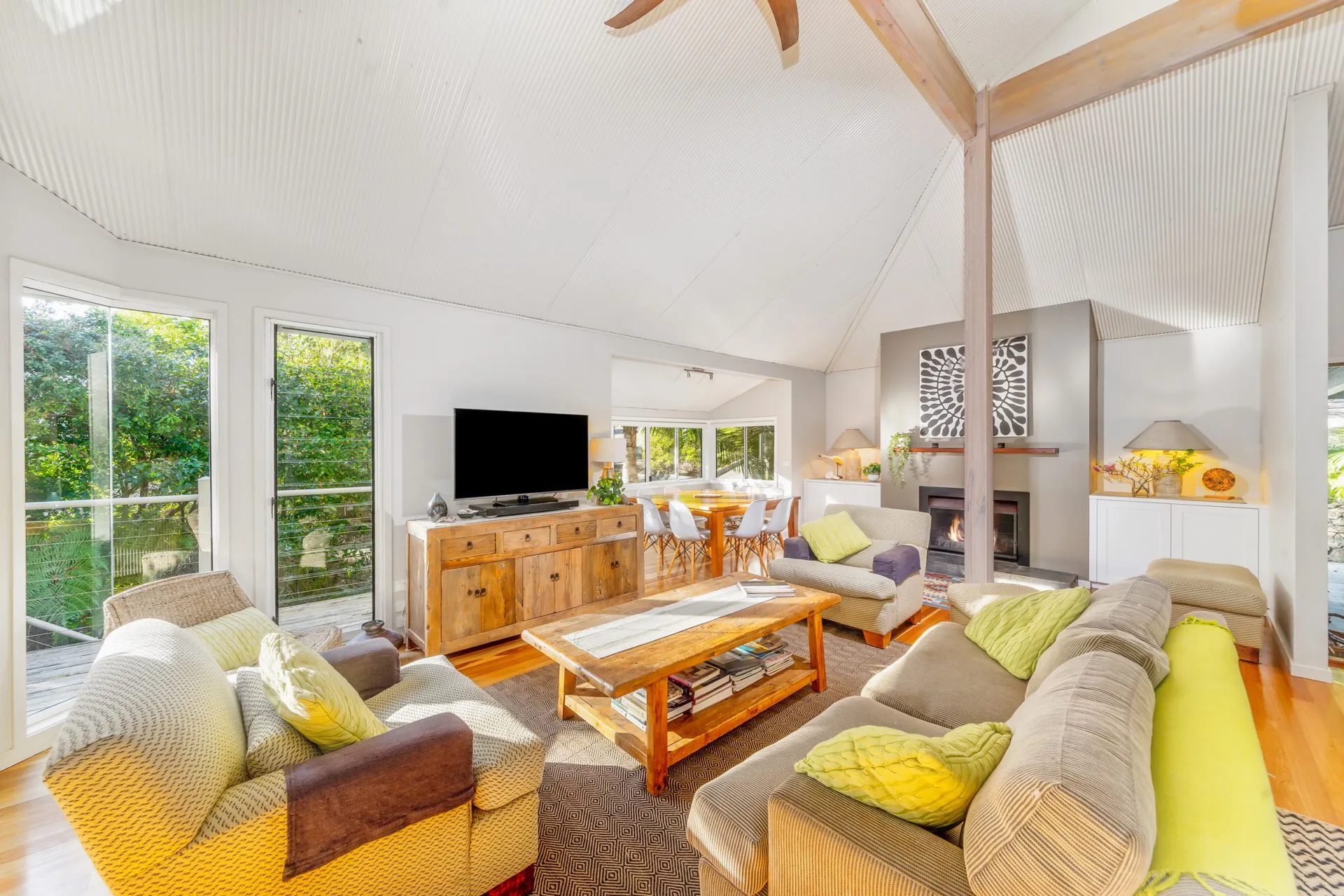 Vaulted living room with timber accents at Iluka