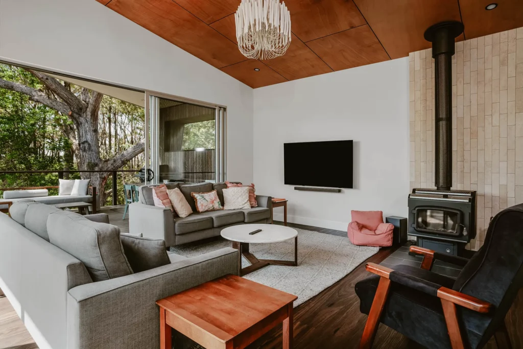 living room layout, with modern furniture surrounded by natural settings