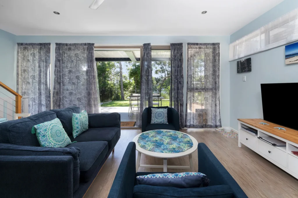 Stylish blue living room at Orion Blue Beach Stay, Vincentia