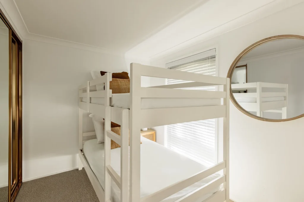 White bunk beds in a bright room at Sandalwood at Huskisson