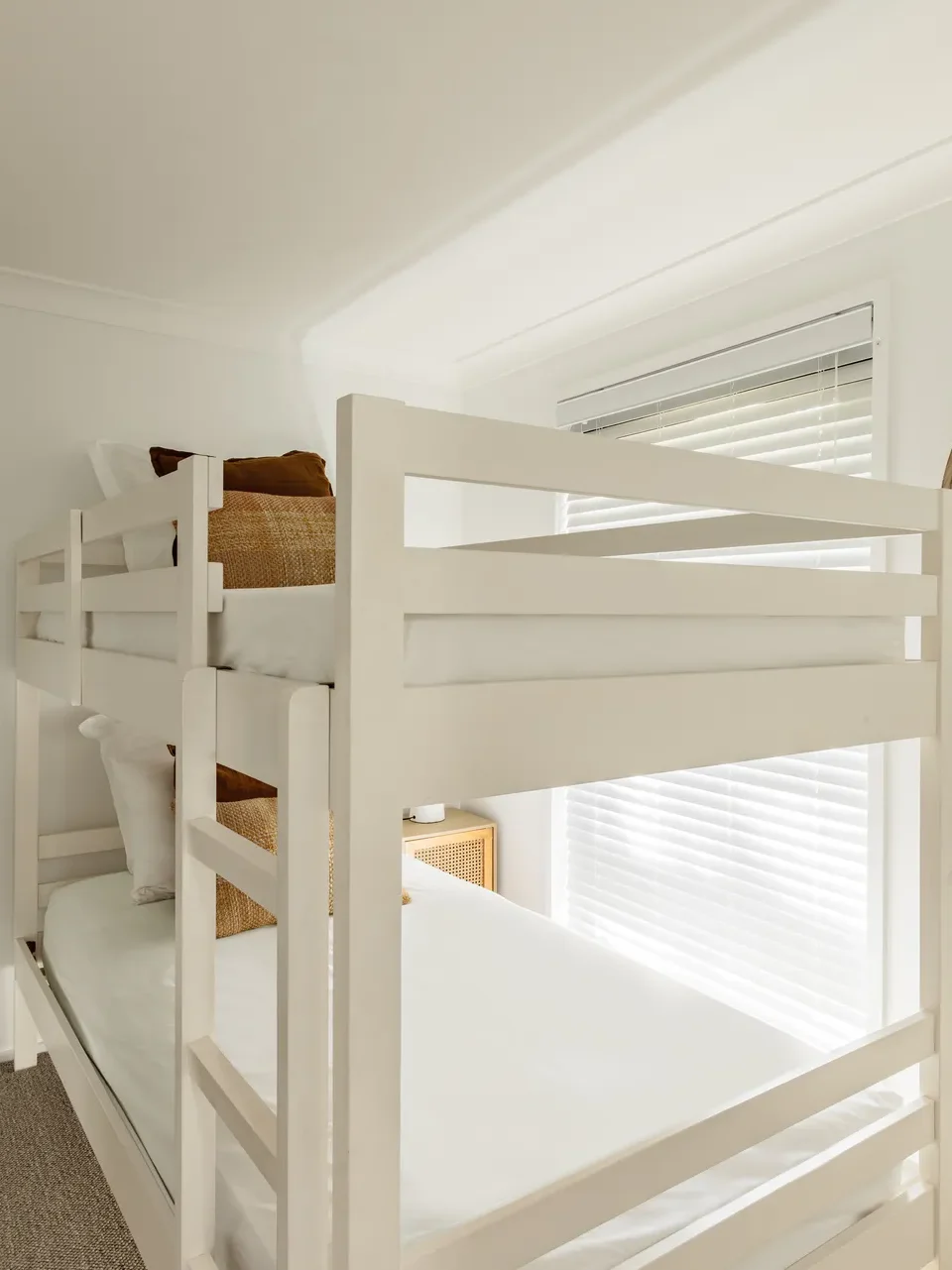 White bunk beds in a bright room at Sandalwood at Huskisson