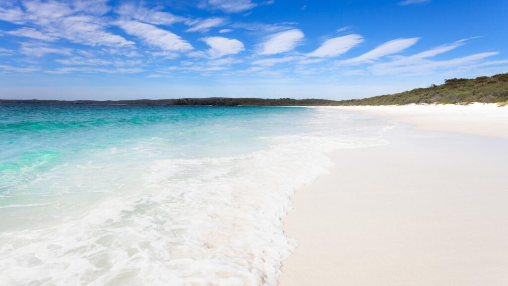 Waves and white sand on Hyams Beach Trail in Australia
