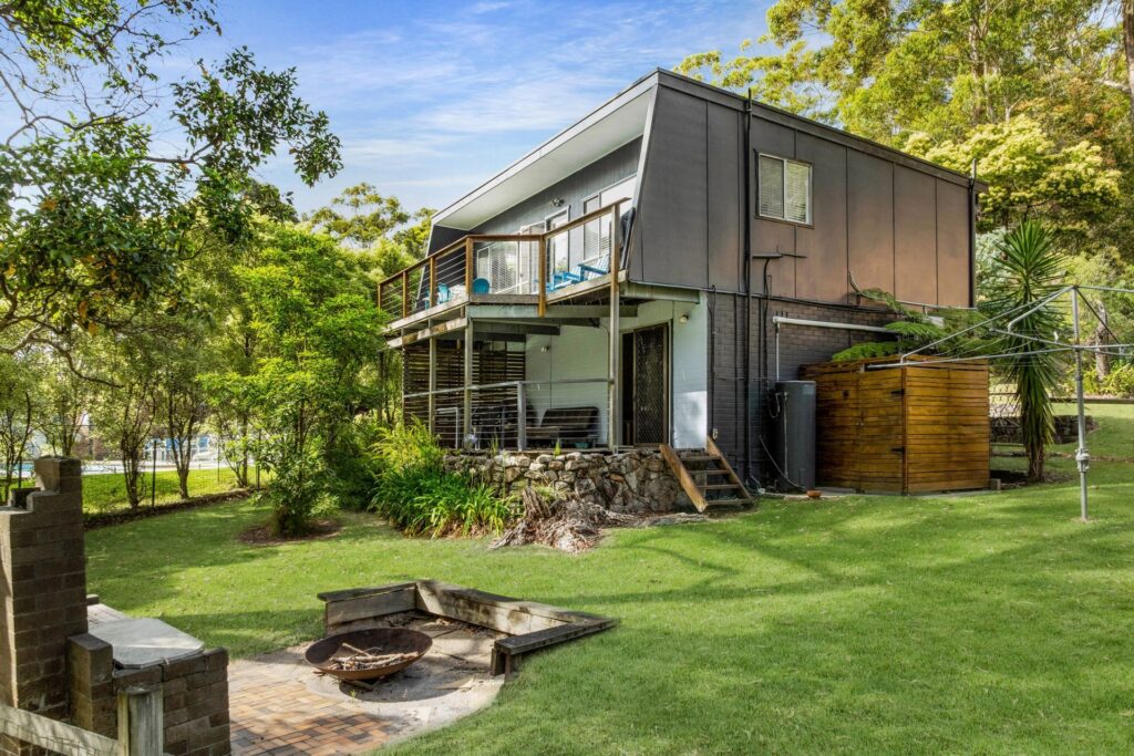 bush baby exterior design with green yard and trees
