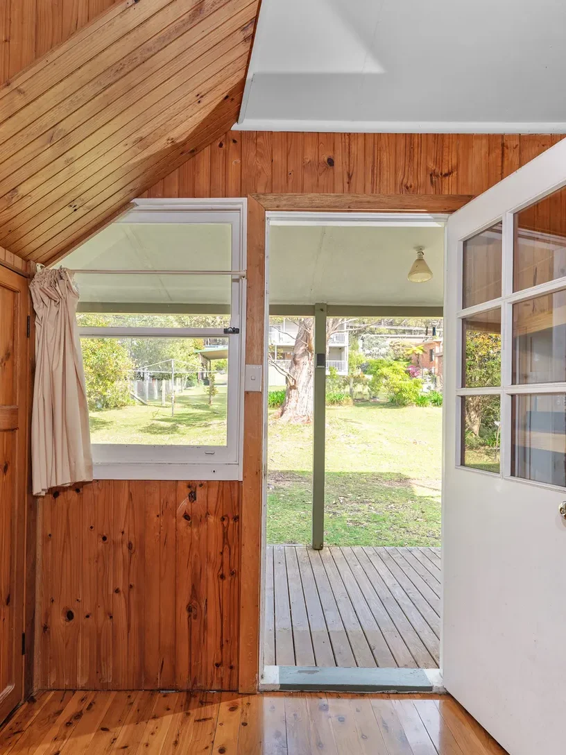 backdoor leading to secluded backyard