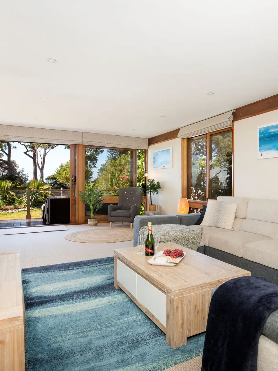 Living room with sofa and garden view in Beach Street Residence, Huskisson