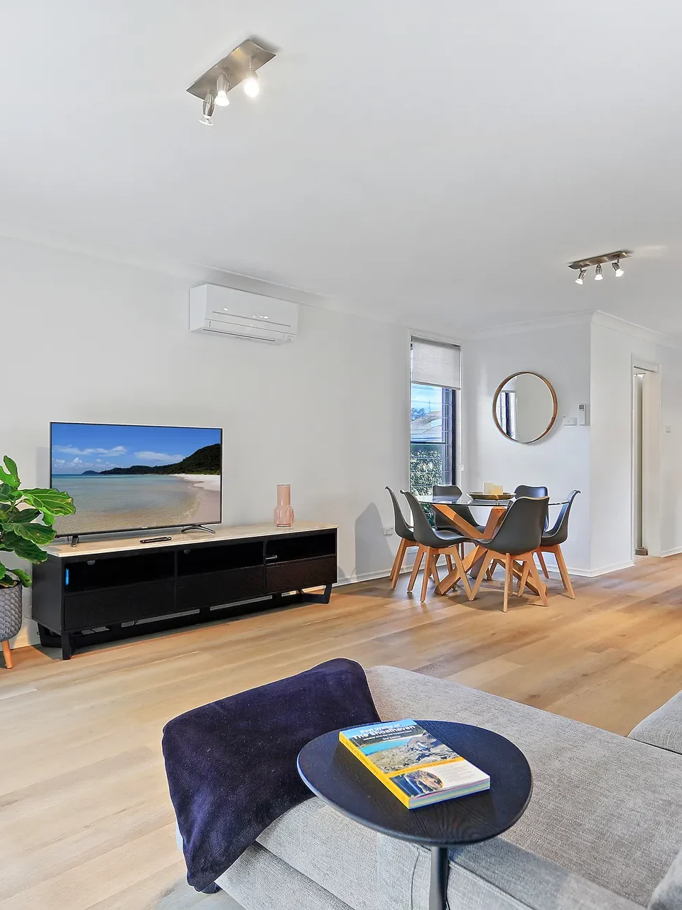 Open-plan living and dining area at Coastal Cove, a couples accommodation in Huskisson