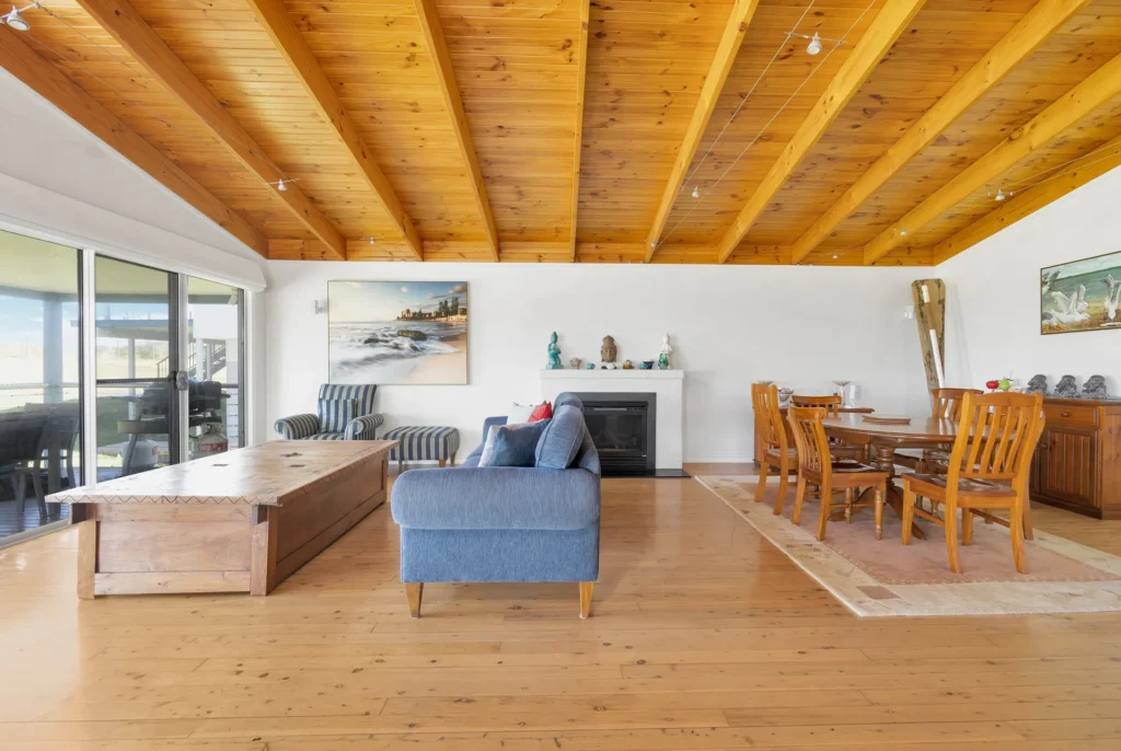 Warm open-plan living and dining area at Sea Dream, Culburra Beach