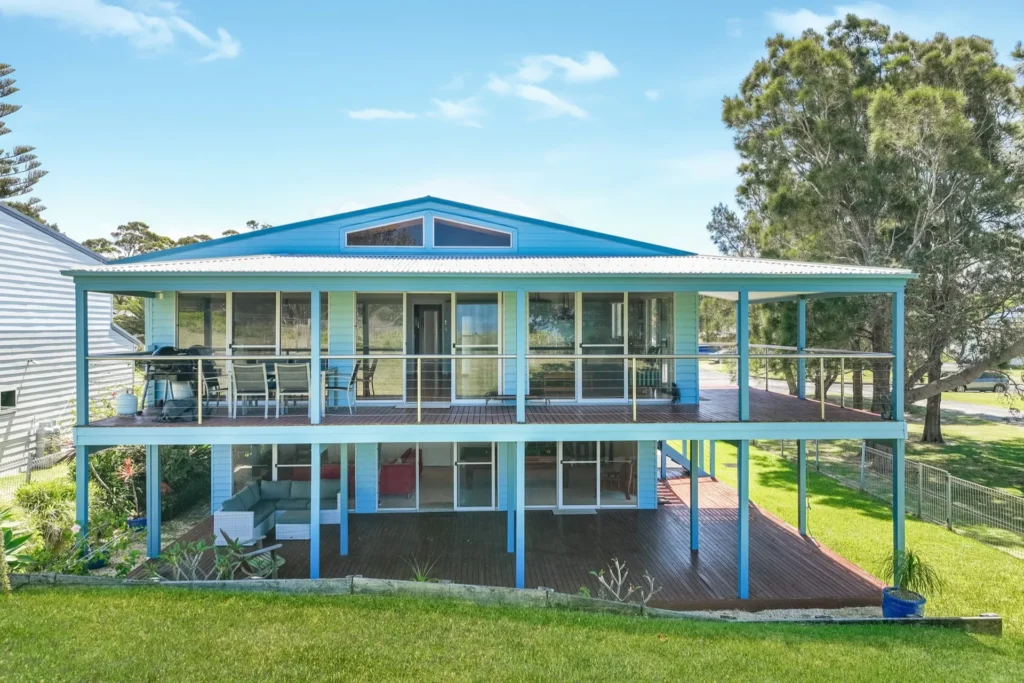 Bright blue holiday home exterior at Sea Dream, Culburra Beach
