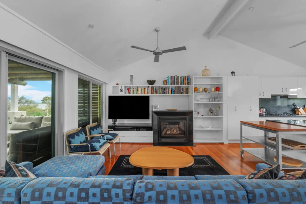 Spacious lounge with fireplace at Surfbreak, Culburra Beach