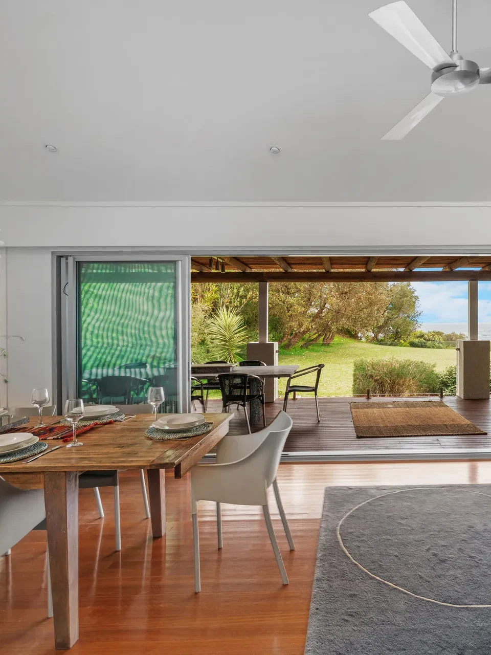 Bright dining area with garden views at Surfbreak, Culburra Beach