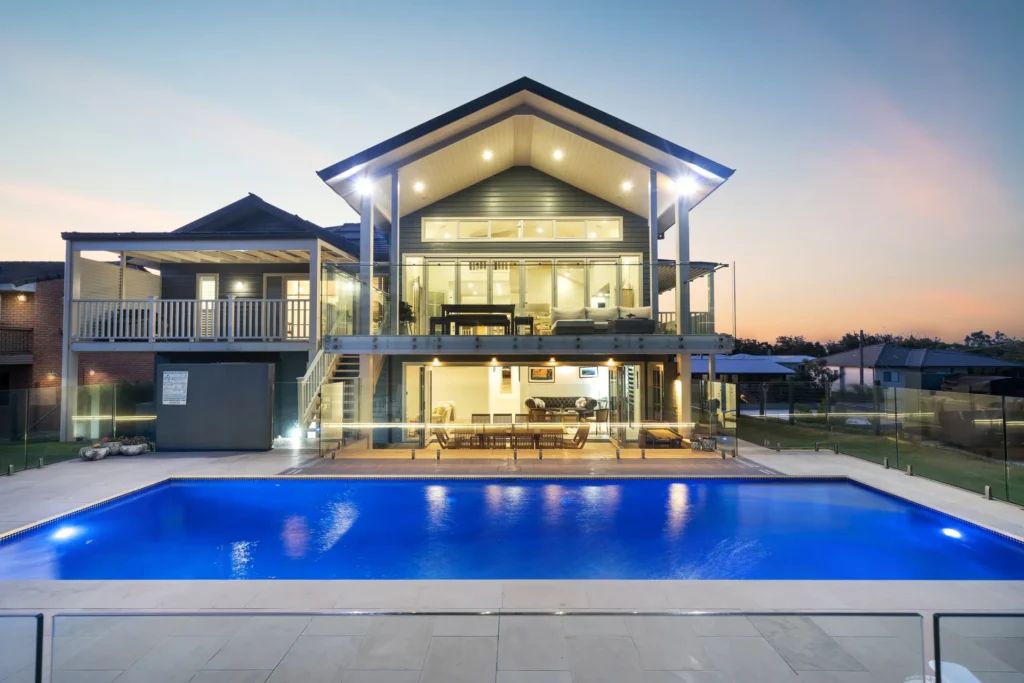 Elegant beach house with illuminated pool at The Cape, Culburra Beach