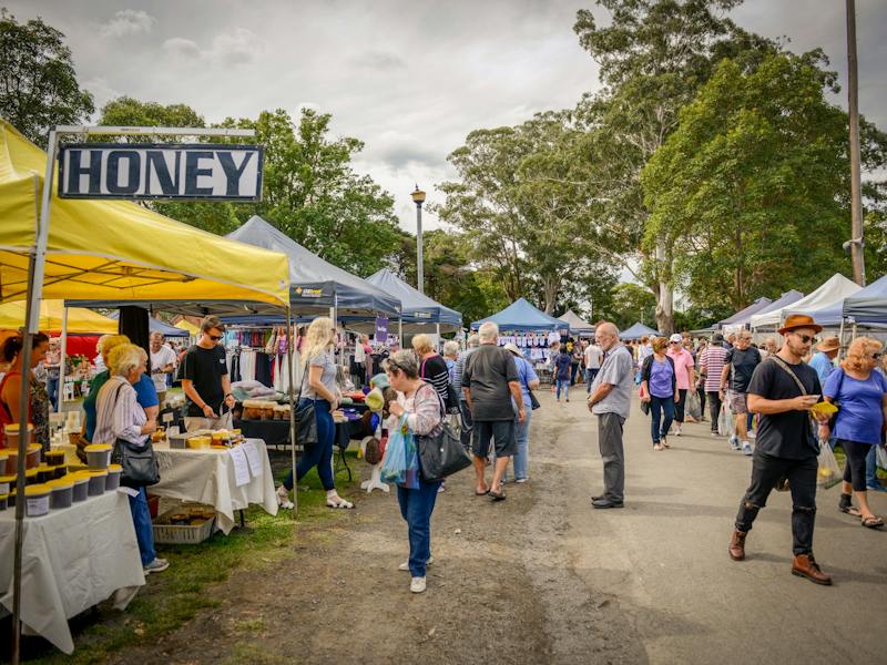 visitors browsing stalls at the Berry Markets