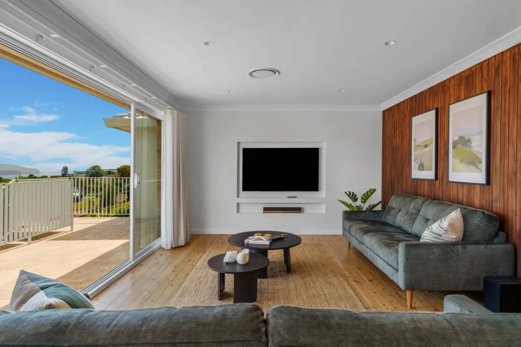 living room with balcony leading to the beach