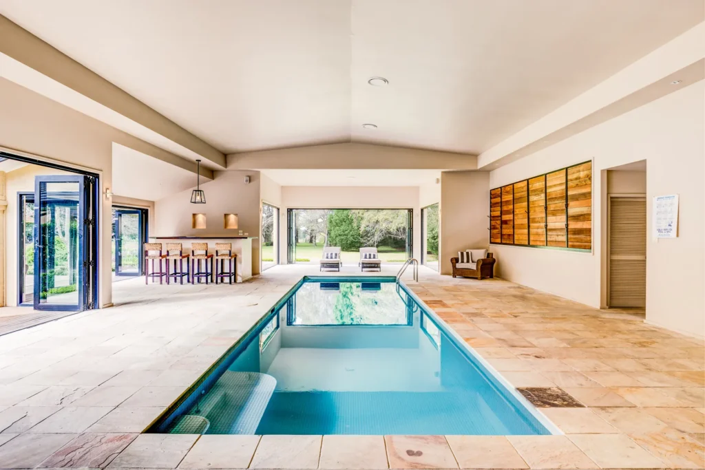 indoor swimming pool opening onto the garden
