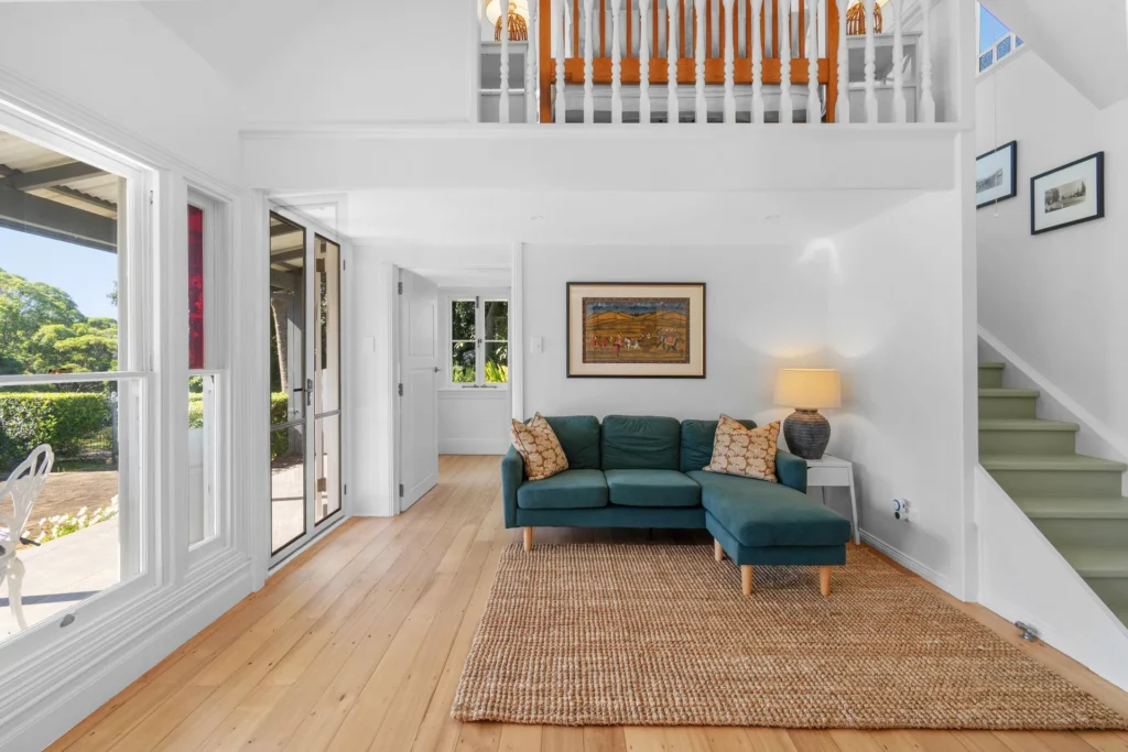 open living area with high ceilings and timber floors