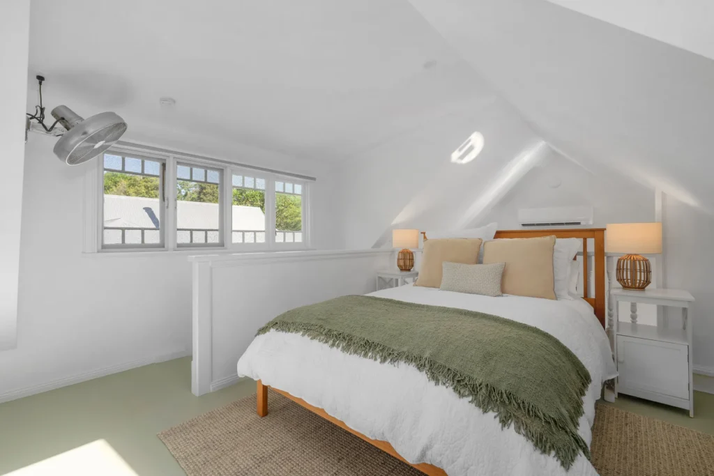 bright upstairs bedroom with white interiors