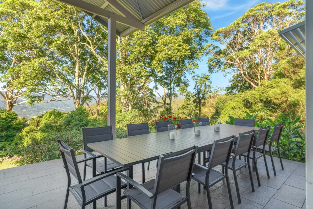 covered outdoor dining area with garden views