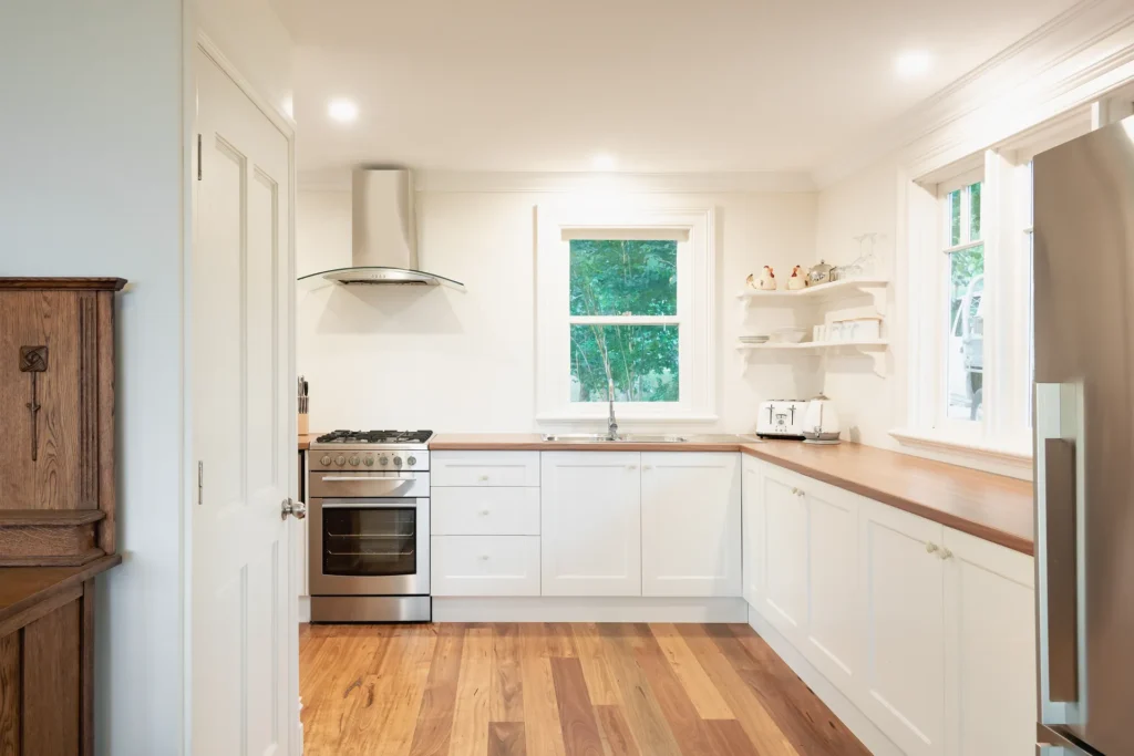bright kitchen featuring timber benchtops