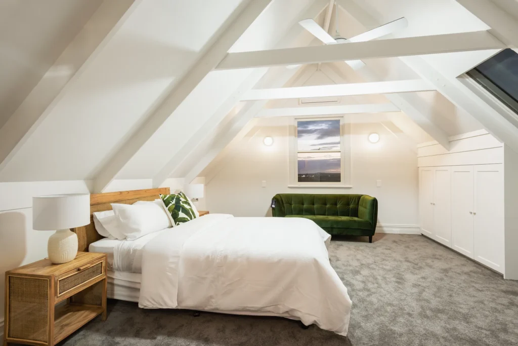 loft bedroom featuring exposed white beams